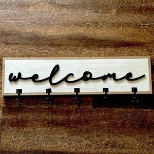 Welcome sign with hooks